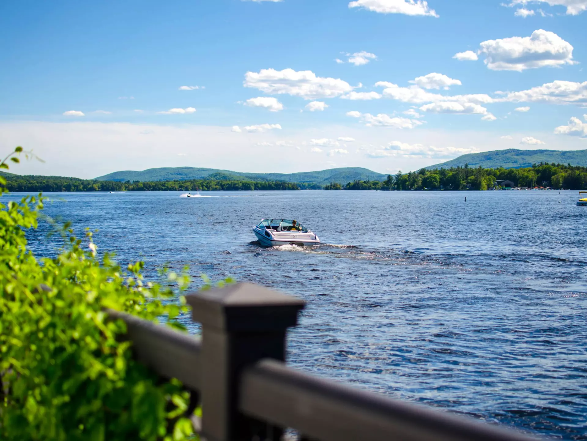 Boat docks on a lake with mountain background. Wolfeboro, New Hampshire.