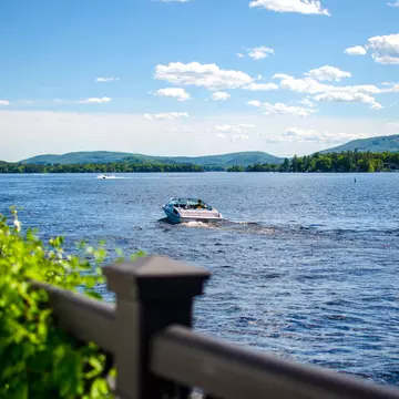 Boat docks on a lake with mountain background. Wolfeboro, New Hampshire.