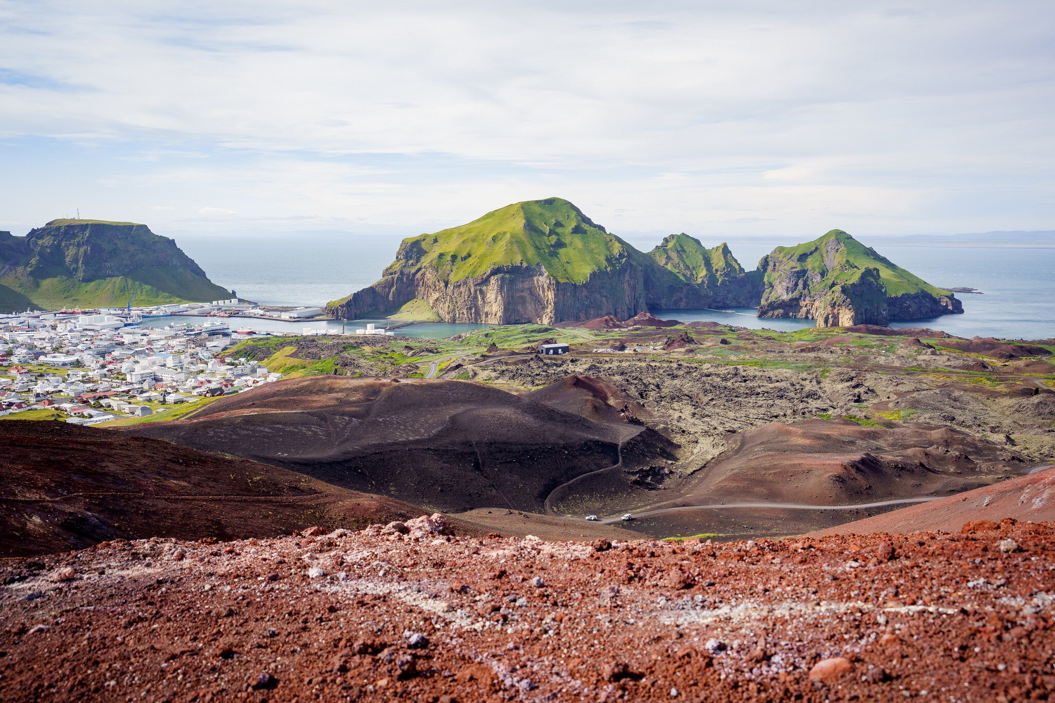 Panoramic view over the city and islands from the top of Mt. Eldfell at Westman islands, South Iceland, Europe.  License Type: media  Download Time: 2023-08-01T15:17:30.000Z  User: FergalCo  Is Editorial: No  purchase_order:   