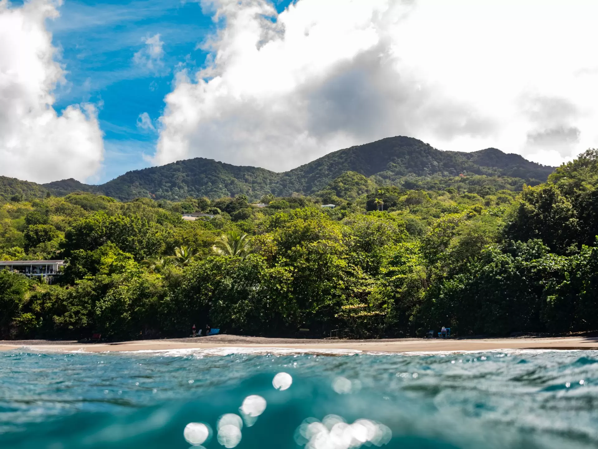 View from water of Woodland’s Beach — a popular snorkel spot on Montserrat.