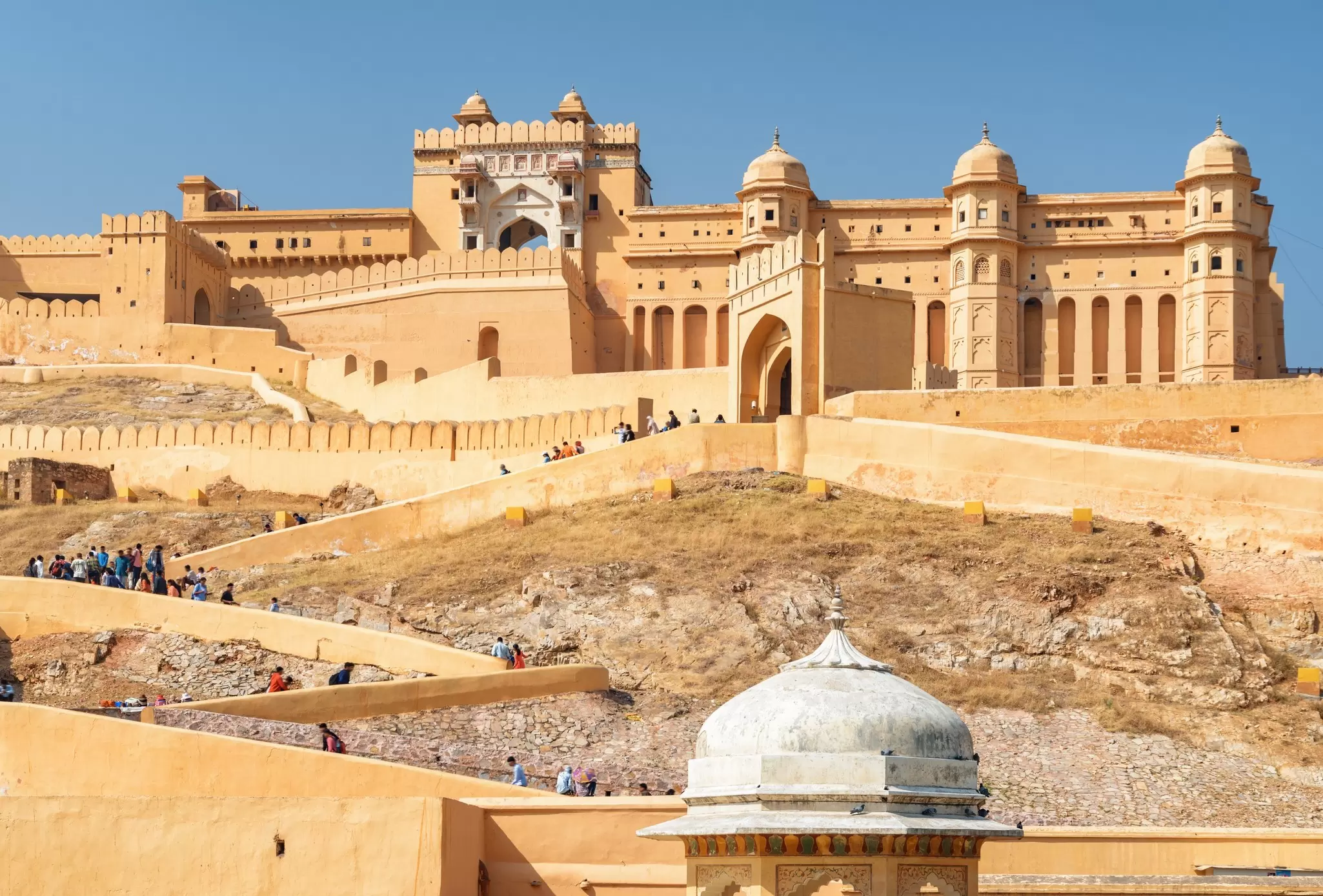 View of the stairs climbing up to the Amber Fort on a sunny day in Jaipur, Rajasthan, India.
