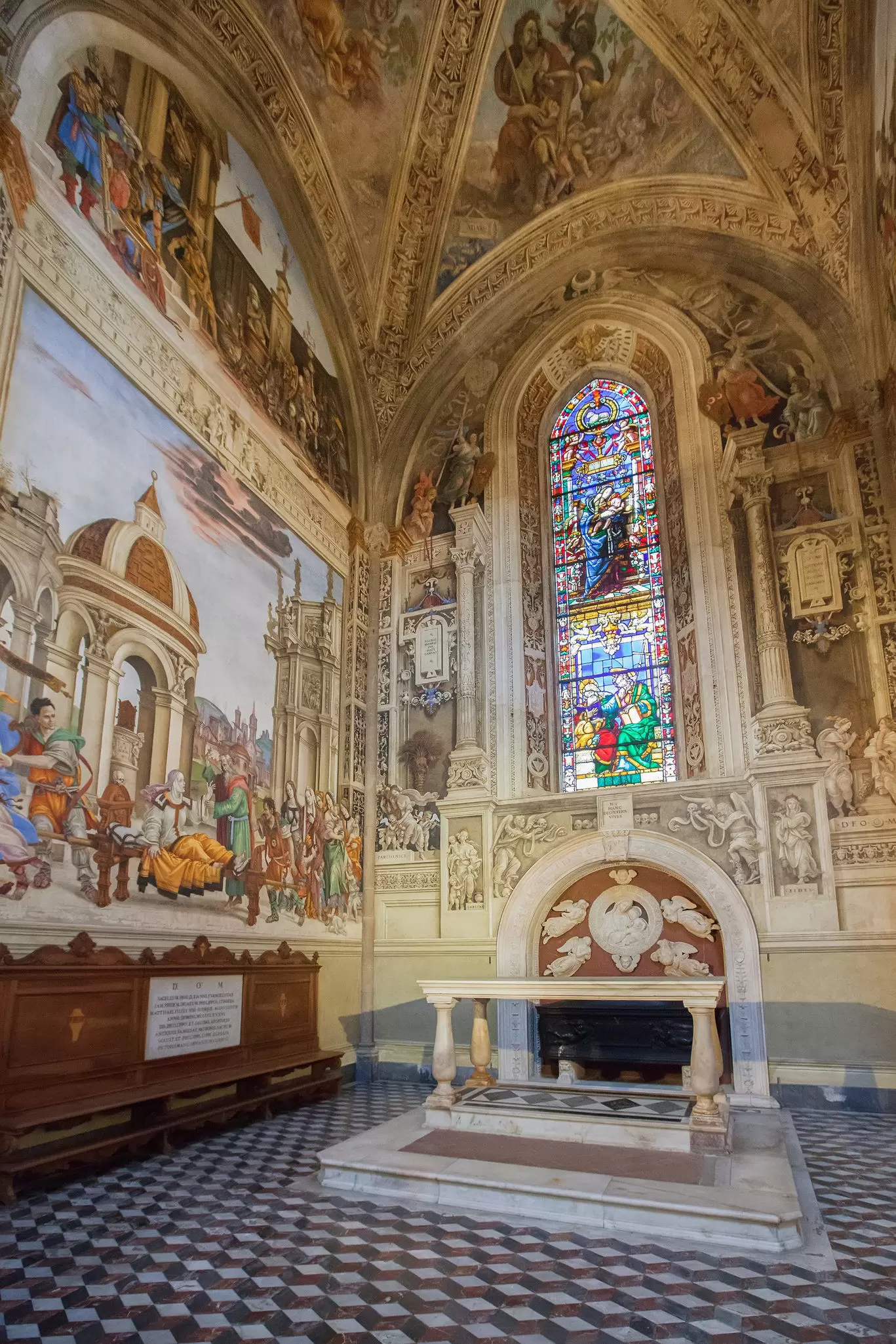 Stained glass window and frescoes by Filippino Lippi inside the Cappella di Filippo Strozzi in the Basilica di Santa Maria Novella in Florence, Italy.