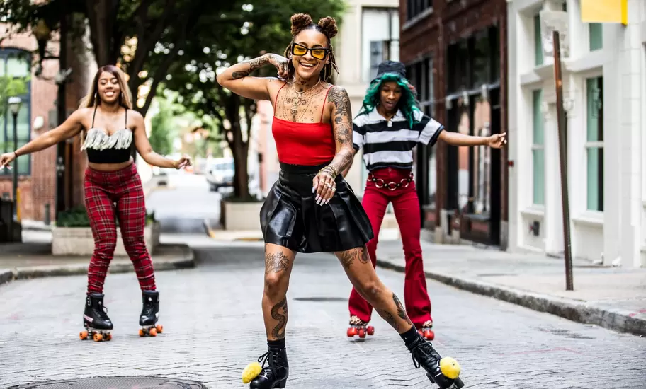 Young women rollerskating in urban area