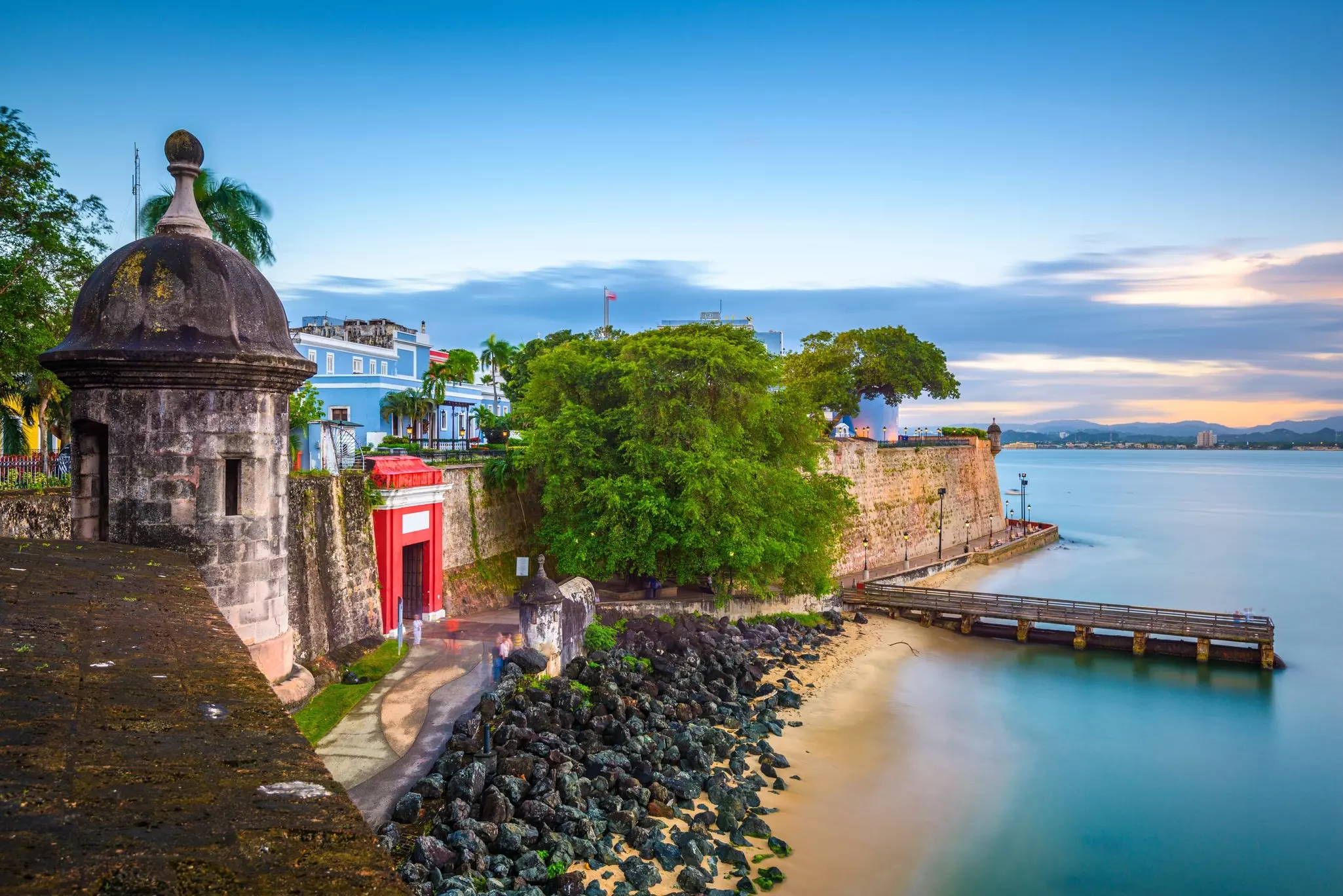 San Juan, Puerto Rico Caribbean coast along Paseo de la Princesa at dusk.