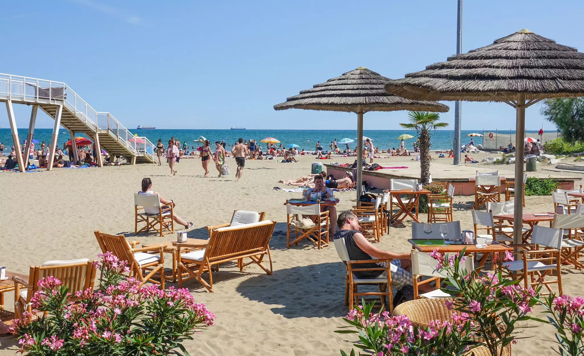 People on the sand at Lido Beach in Venice, Italy. 