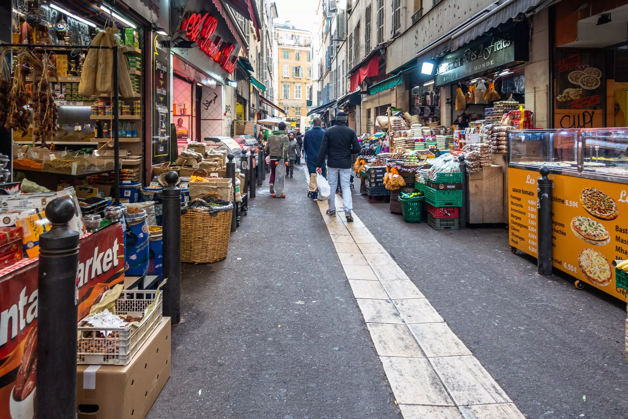 View of Marseille's Noailles quarter with African shops and boutique lined along the street.