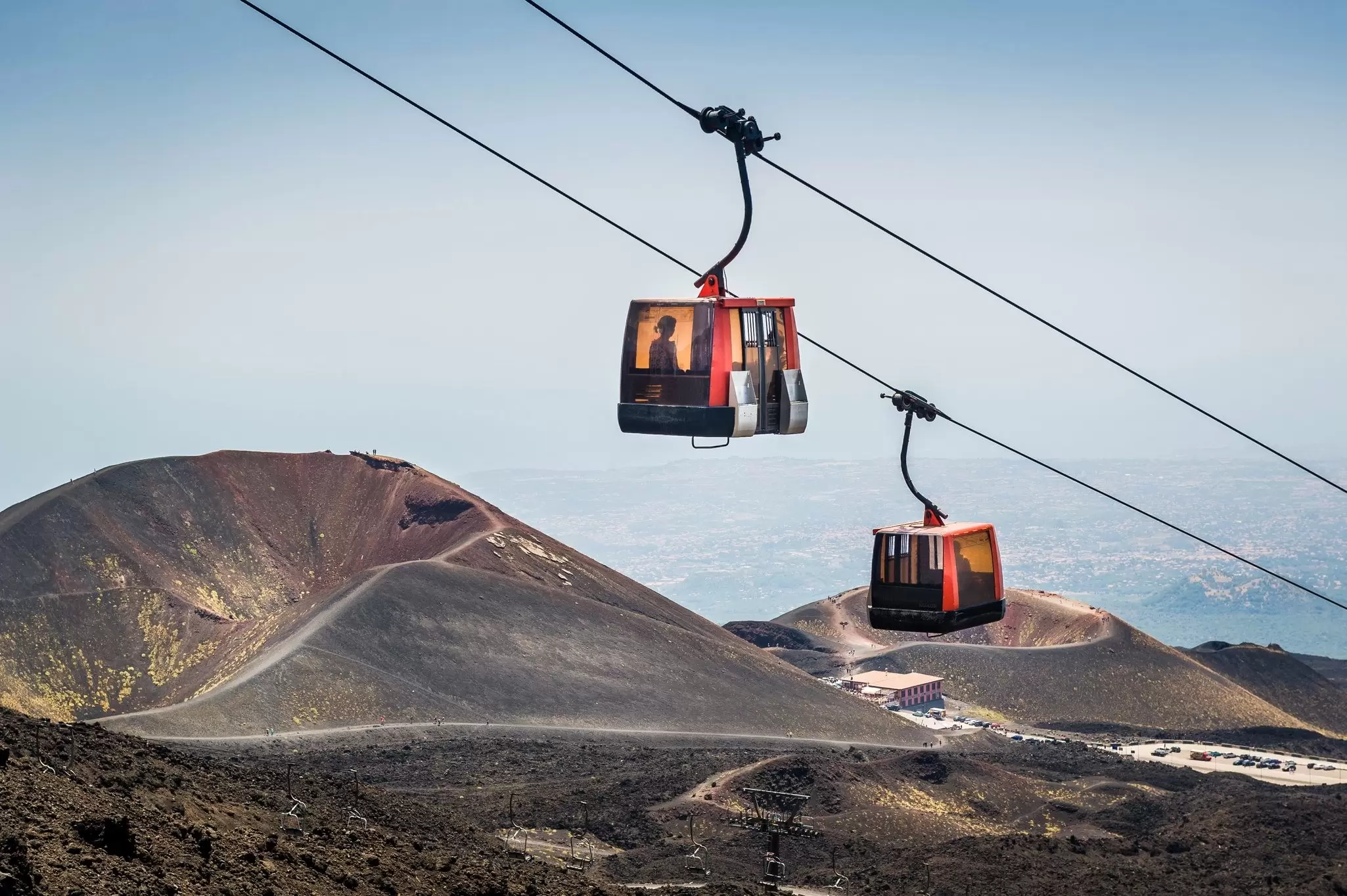 People ride the Funivia del Etna cable railway up to Mt. Etna volcano.