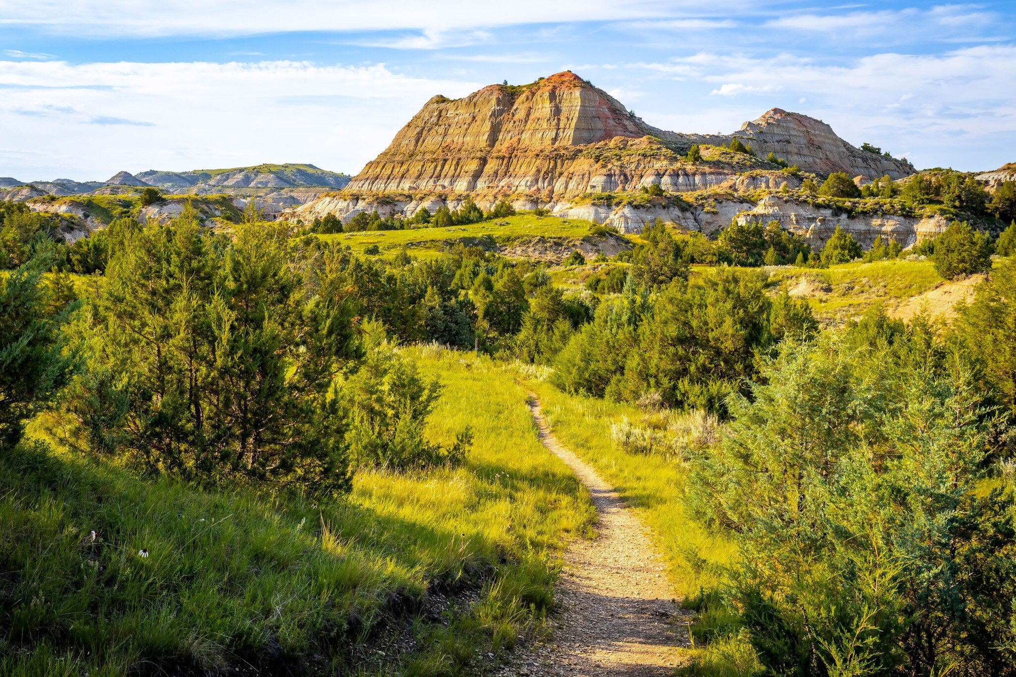 A trail winding through the majestic canyons of Theodore Roosevelt National Park, North Dakota
