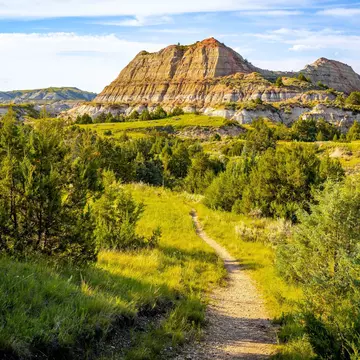 A trail winding through the majestic canyons of Theodore Roosevelt National Park, North Dakota