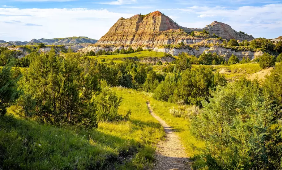 A trail winding through the majestic canyons of Theodore Roosevelt National Park, North Dakota