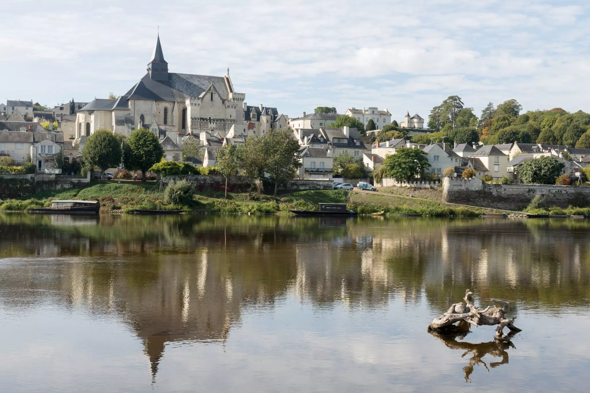 A riverside village with an ancient stone church in the center.