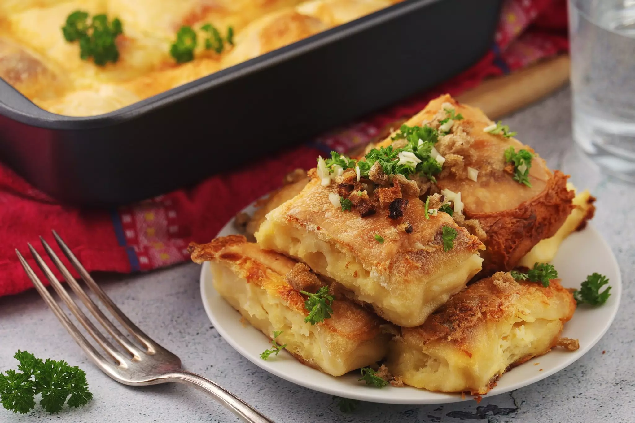 A plate of rectangular baked dumplings