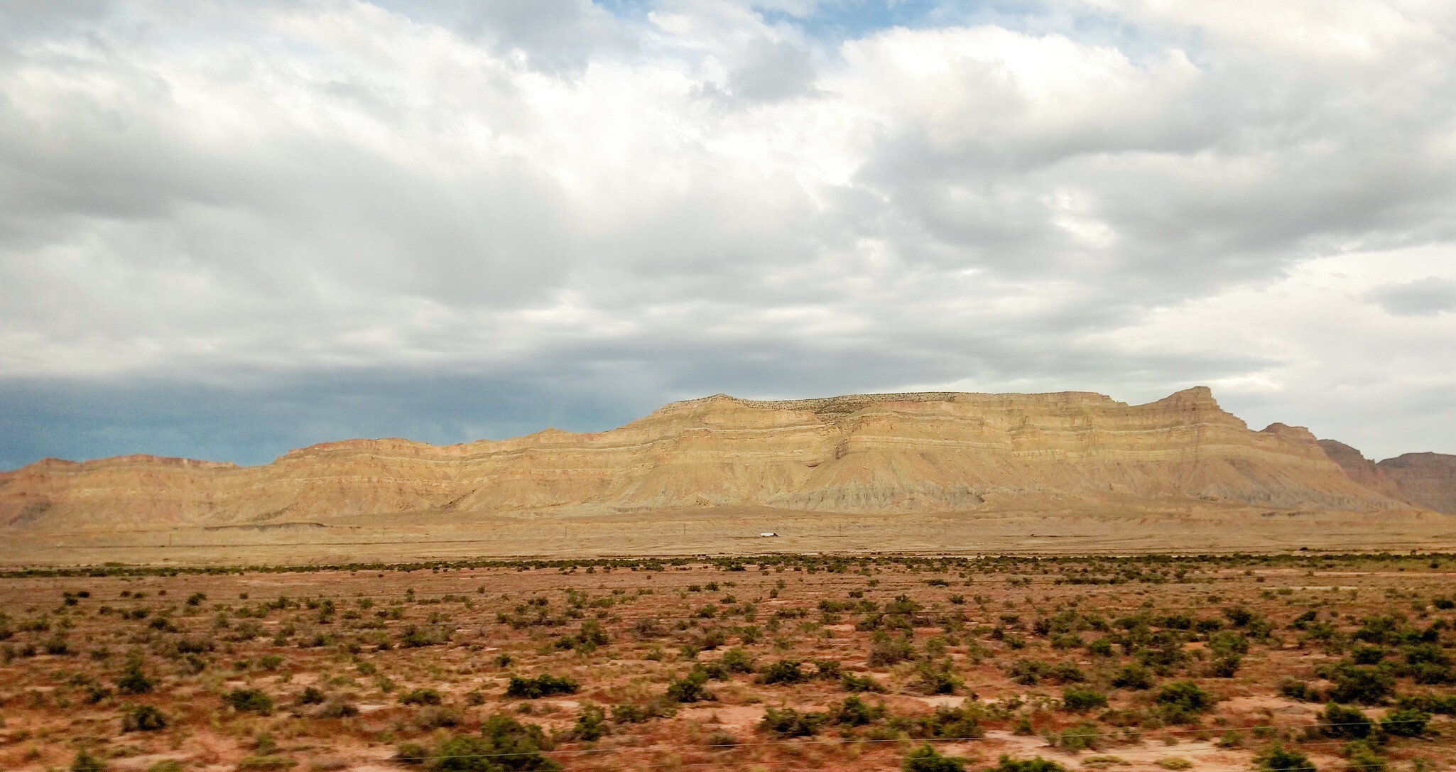 A desert landscape, with yellow sandy hills.