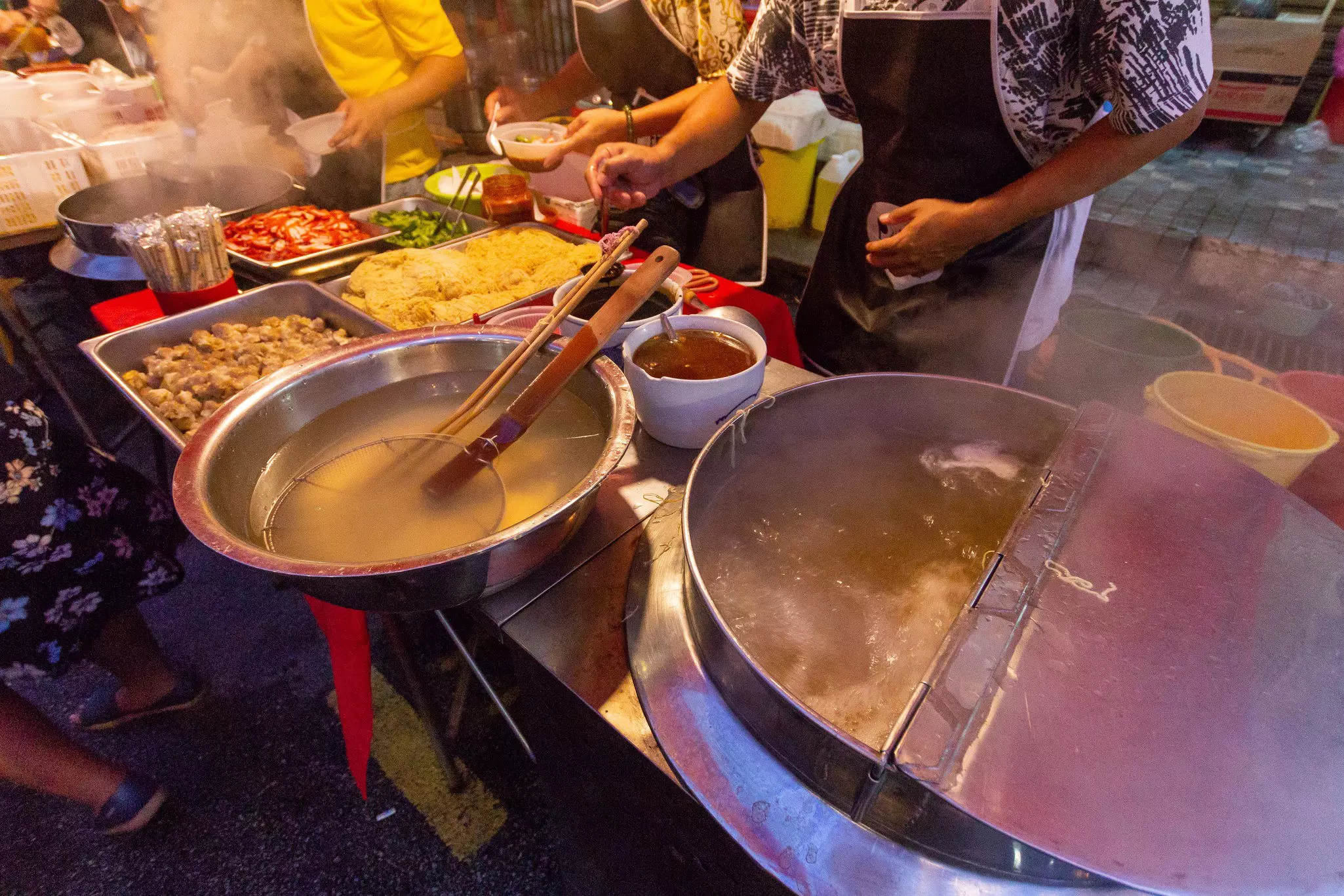 A cook preparing Malaysian street food in Penang.