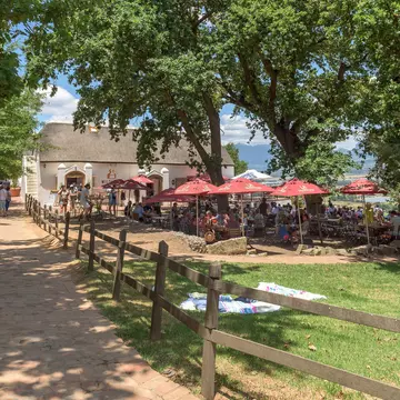 Paarl, South Africa - Dec 26, 2021: Restaurant and picnic area at Spice Route near Paarl in the Western Cape Province. People are visible