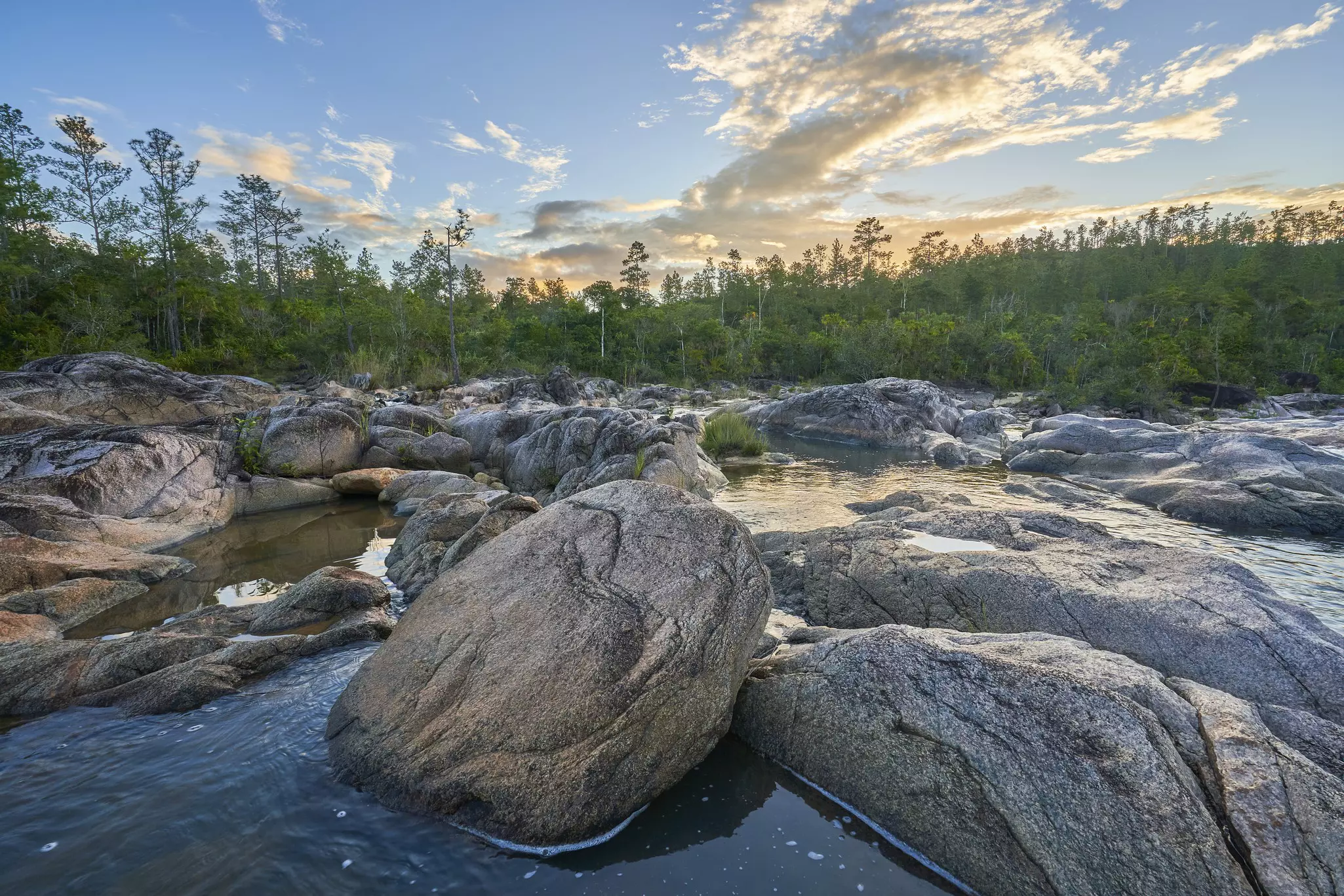 Beautiful sunrise at Río on Pool's cascading water in the Mountain Pine Ridge Forest Reserve