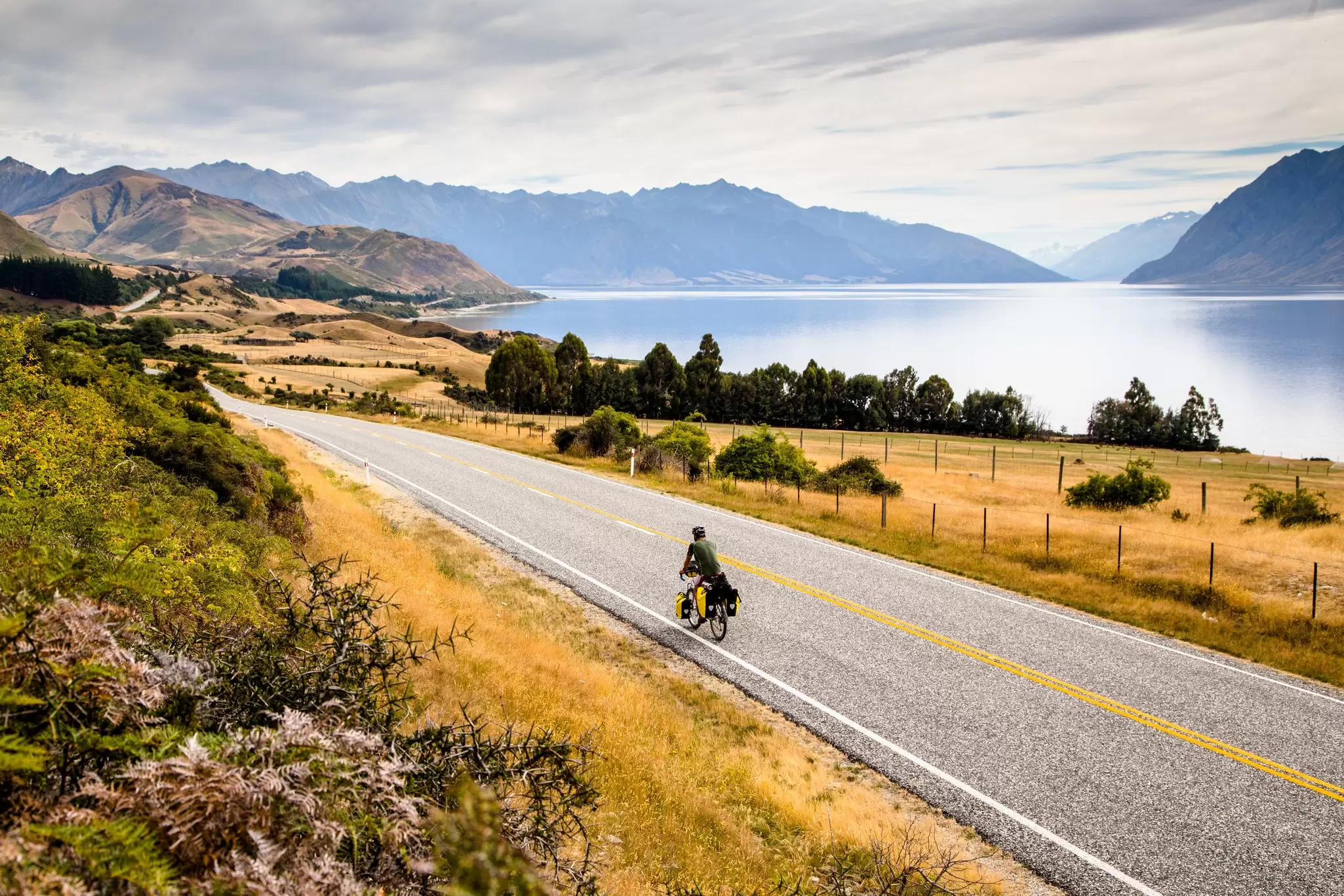 Bike touring through New Zealand's Southern Alps. Tara Kenny/Shutterstock