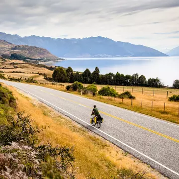 Bike touring through New Zealand's Southern Alps. Tara Kenny/Shutterstock