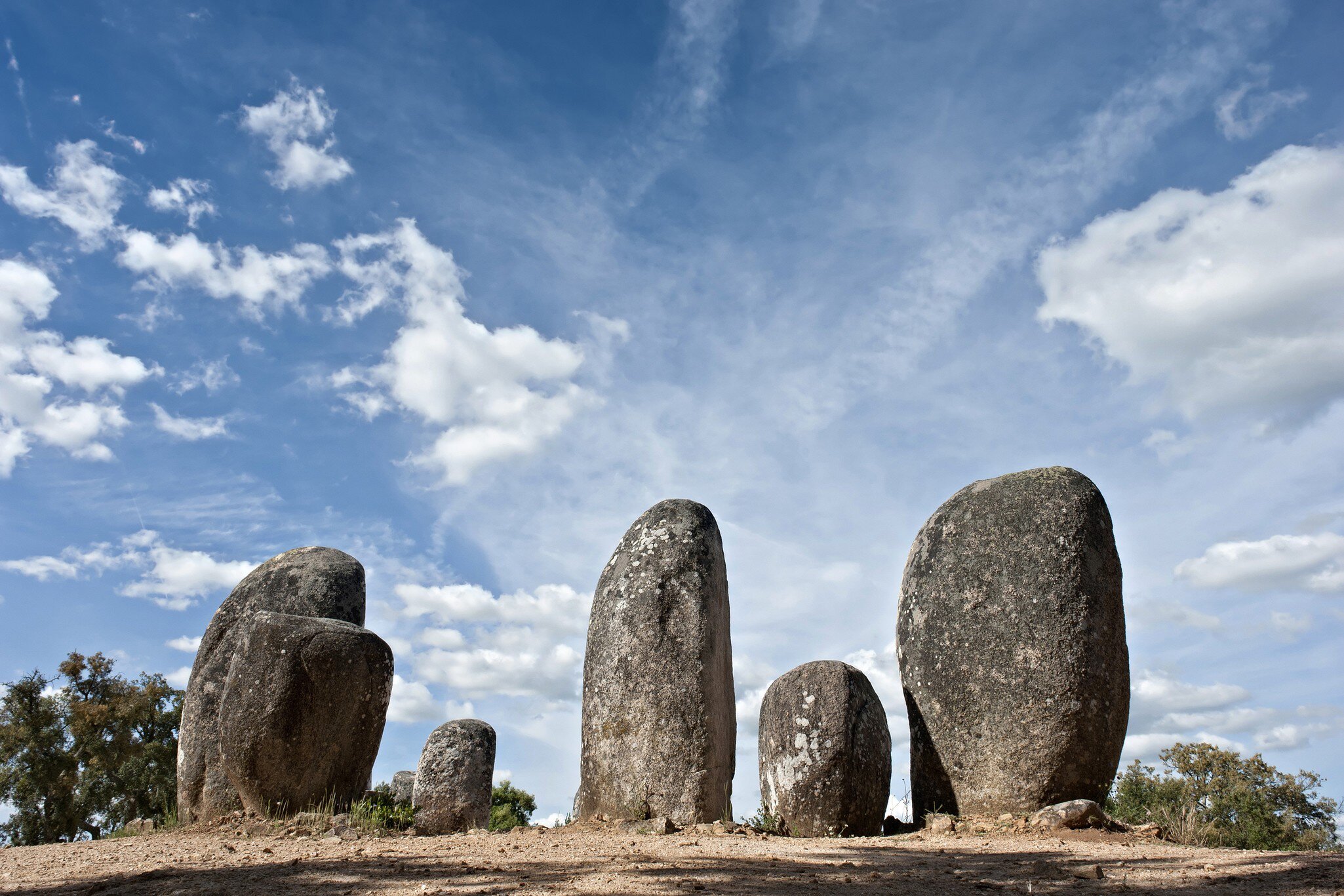 View of the menhirs at the megalithic monument of Cromeleque dos Almendres in Évora, Portugal.
