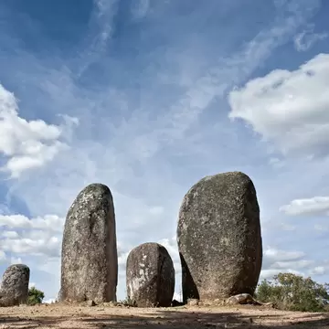 View of the menhirs at the megalithic monument of Cromeleque dos Almendres in Évora, Portugal.