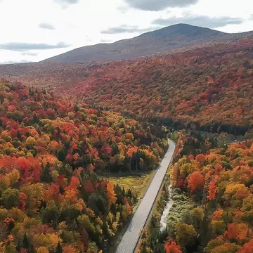 There might be no more beautiful drive in the world than a road trip through Vermont’s fall foliage. Shutterstock