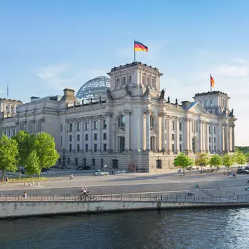 Reichstag building (german government) and river Spree in Berlin, Germany  License Type: media  Download Time: 2023-12-31T16:03:34.000Z  User: Norma.PrauseBrewer_LonelyPlanet  Is Editorial: No  purchase_order: 56530  
