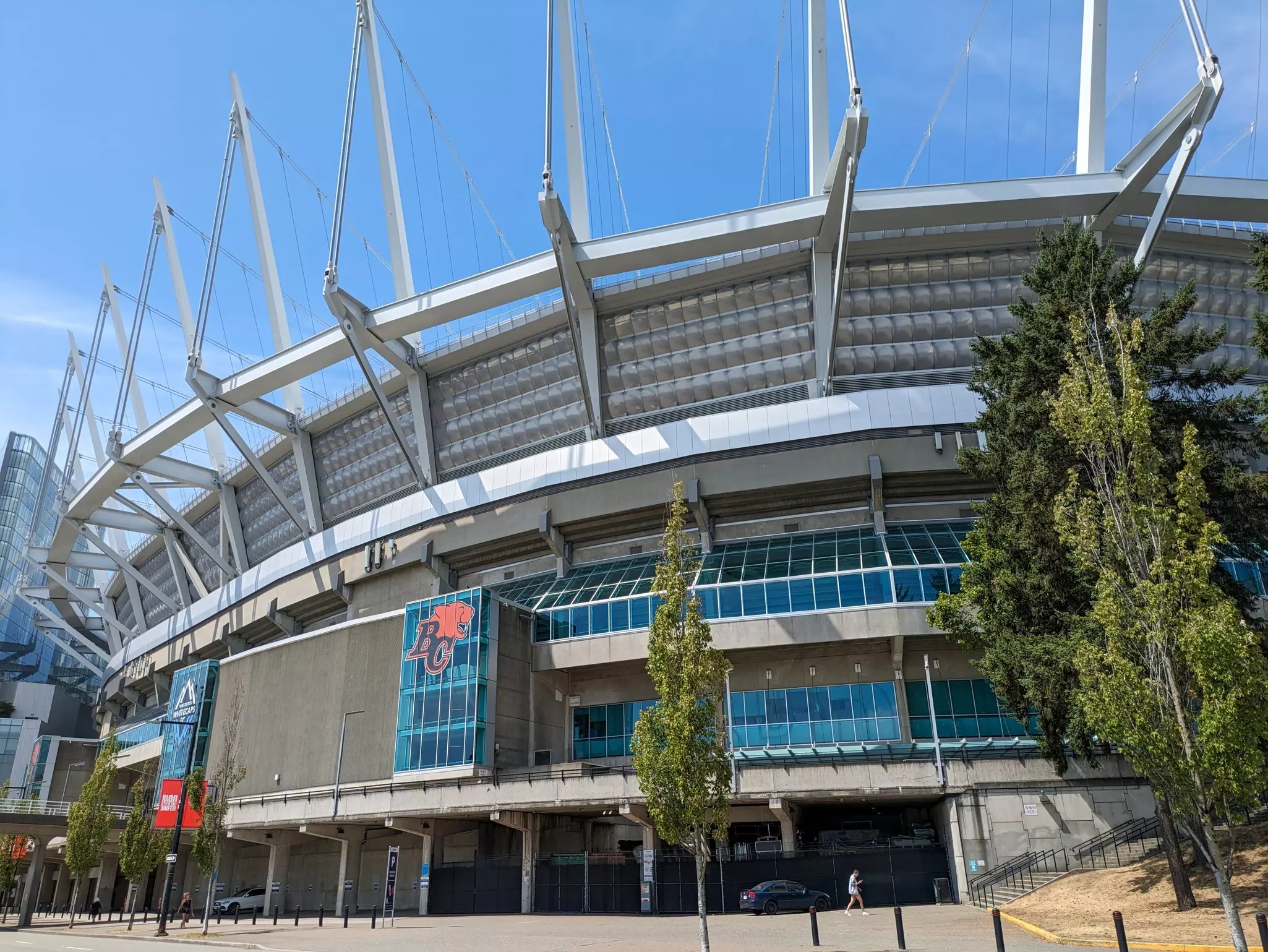 The exterior of a large stadium with an icon of a roaring lion next to the letters "BC"