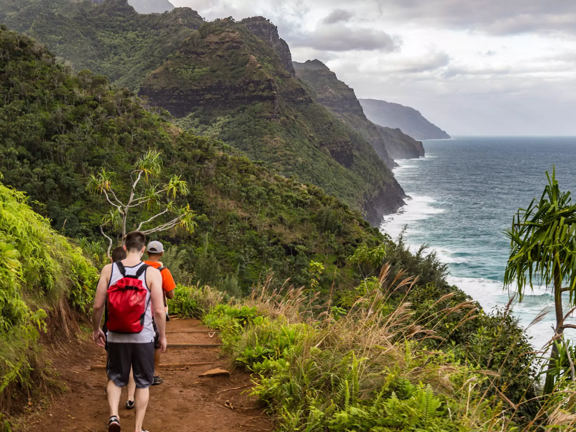 Hikers on the Kalalau Trail on the Na Pali Coast of Kauai © Alexander Howard/Lonely Planet