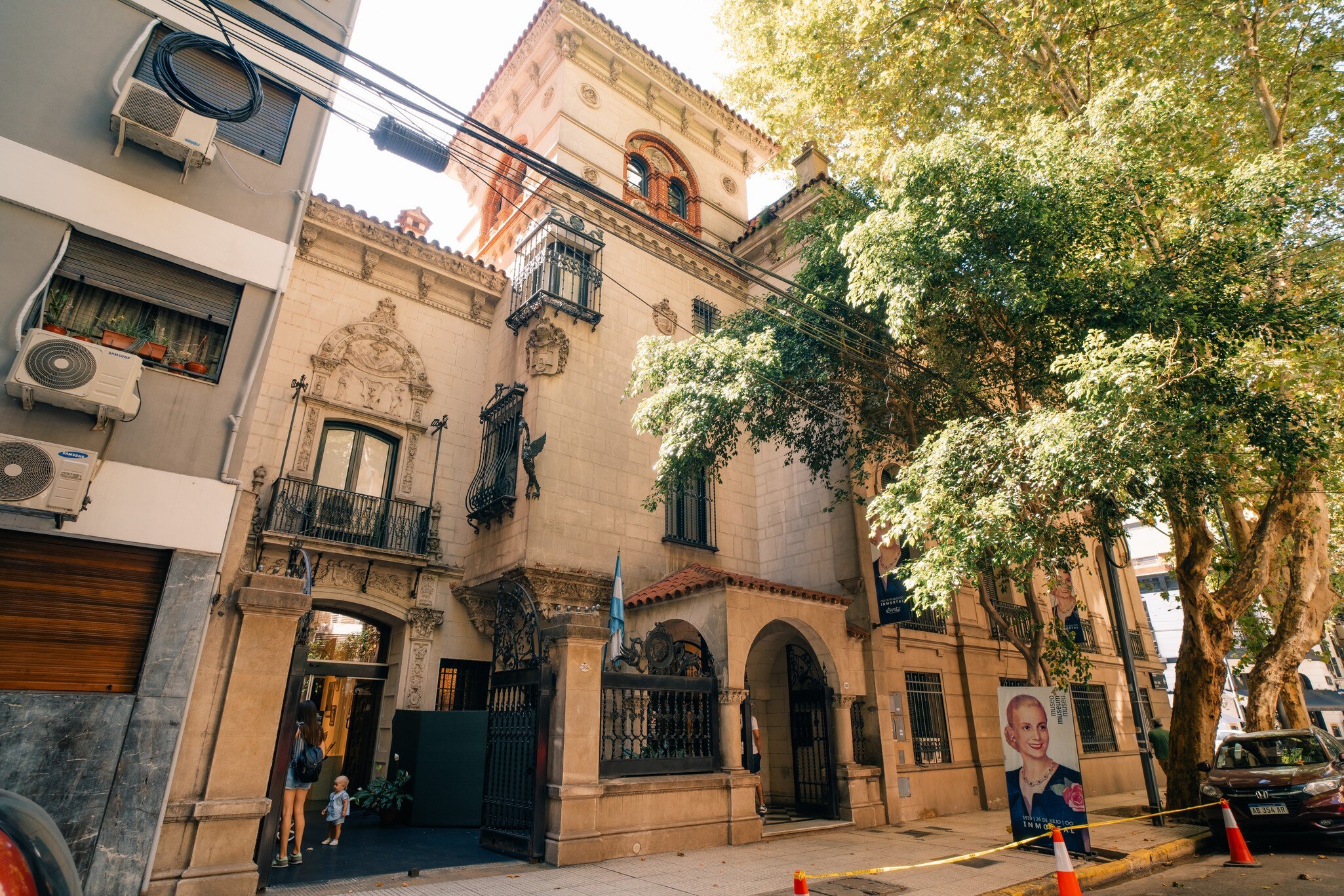 Exterior of Museo Evita in Buenos Aires, Argentina. Green tree on right side.