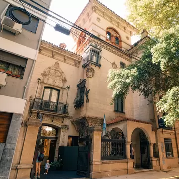 Exterior of Museo Evita in Buenos Aires, Argentina. Green tree on right side.