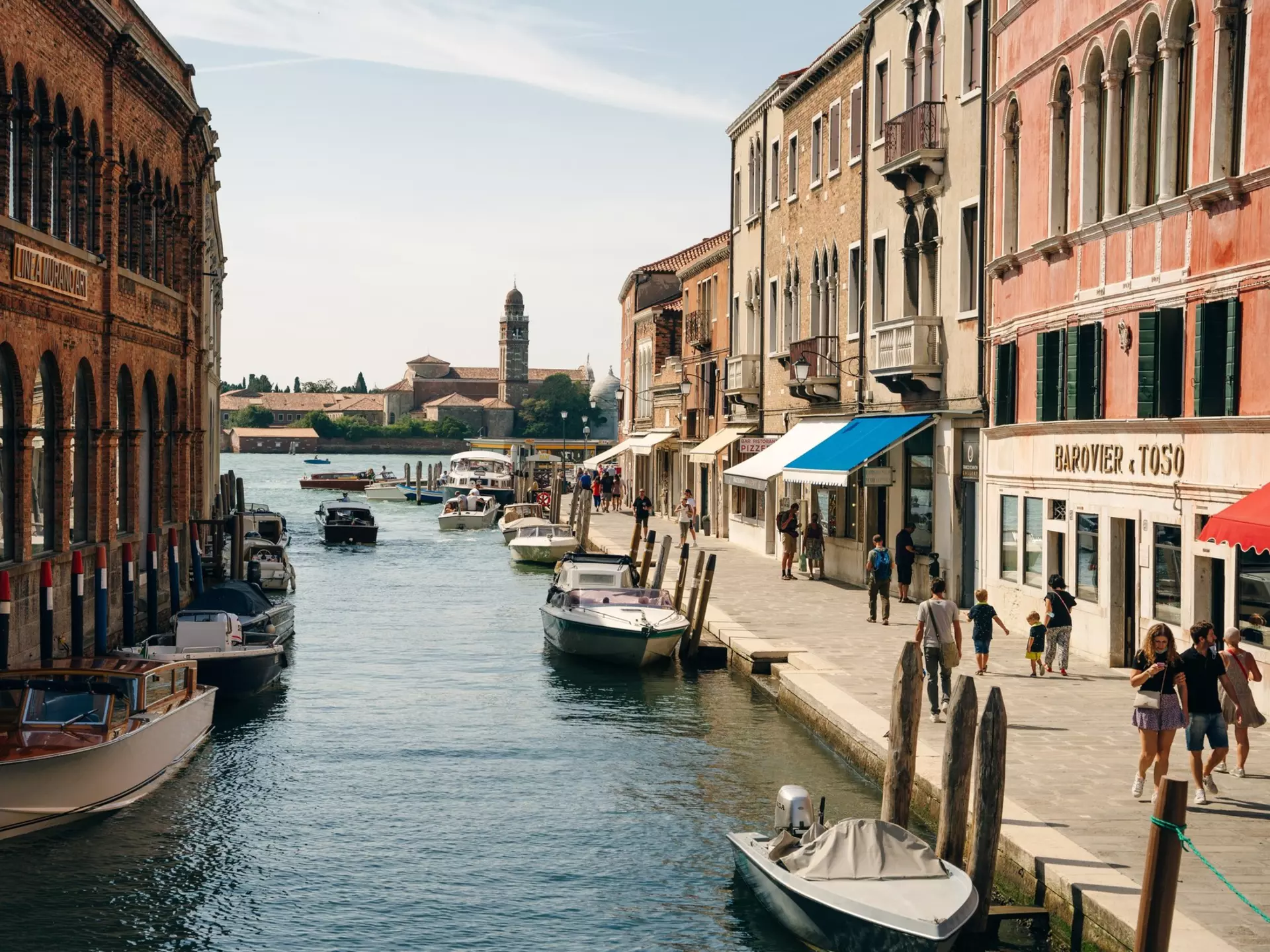 View of boats on the canal in the island of Murano in Venice, Italy.