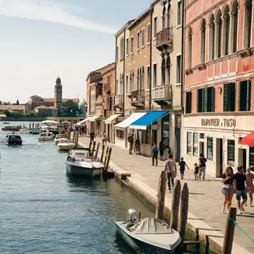 View of boats on the canal in the island of Murano in Venice, Italy.