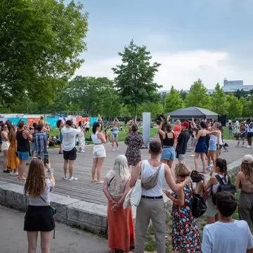 A crowd of people at Mauerpark in Berlin, Germany.