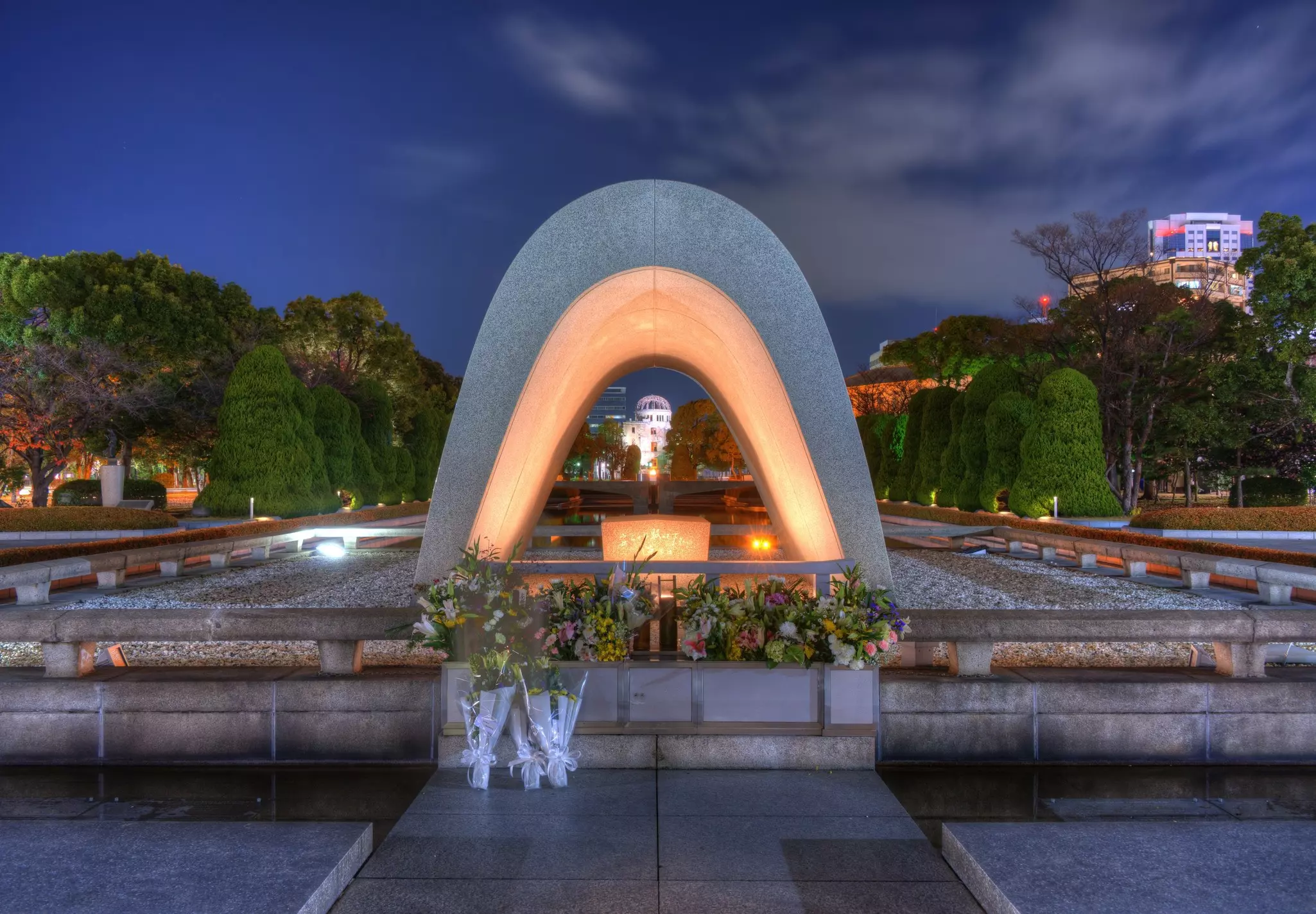 A domed sculpture lit from below in a park in Japan.