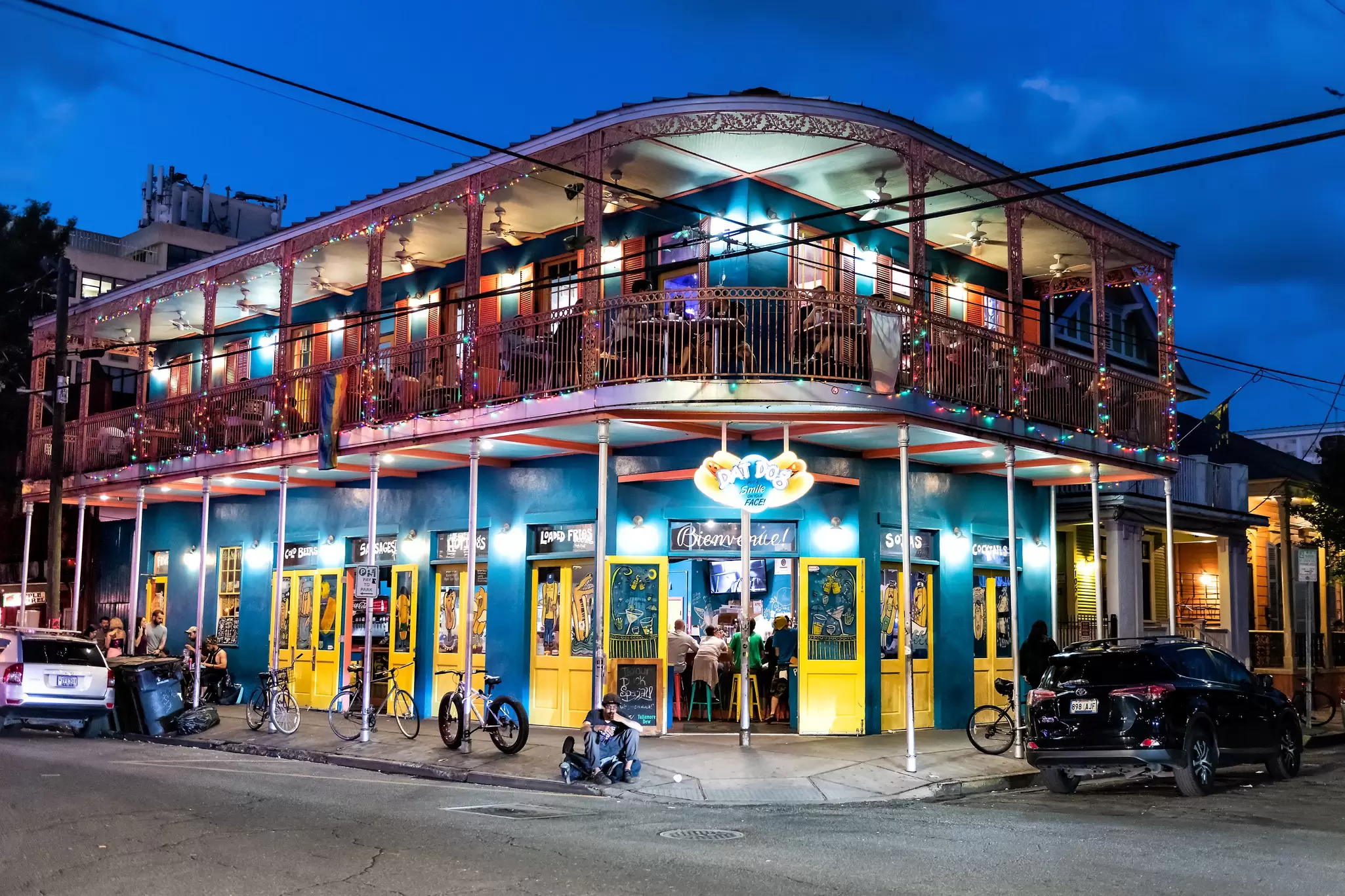Nighttime view of the famous restaurant 'Dat Dog' on Frenchmen Street in New Orleans, Louisiana.