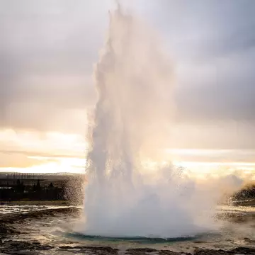 Eruption of the Strokkur geyser in Iceland during winter.