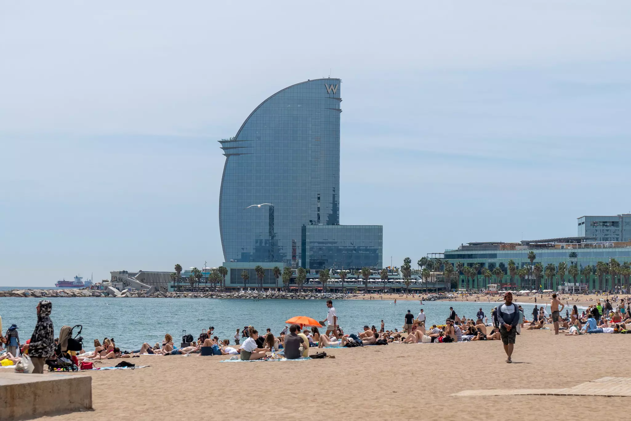 The sail-shaped W Hotel rises above Platja de Sant Sebastià