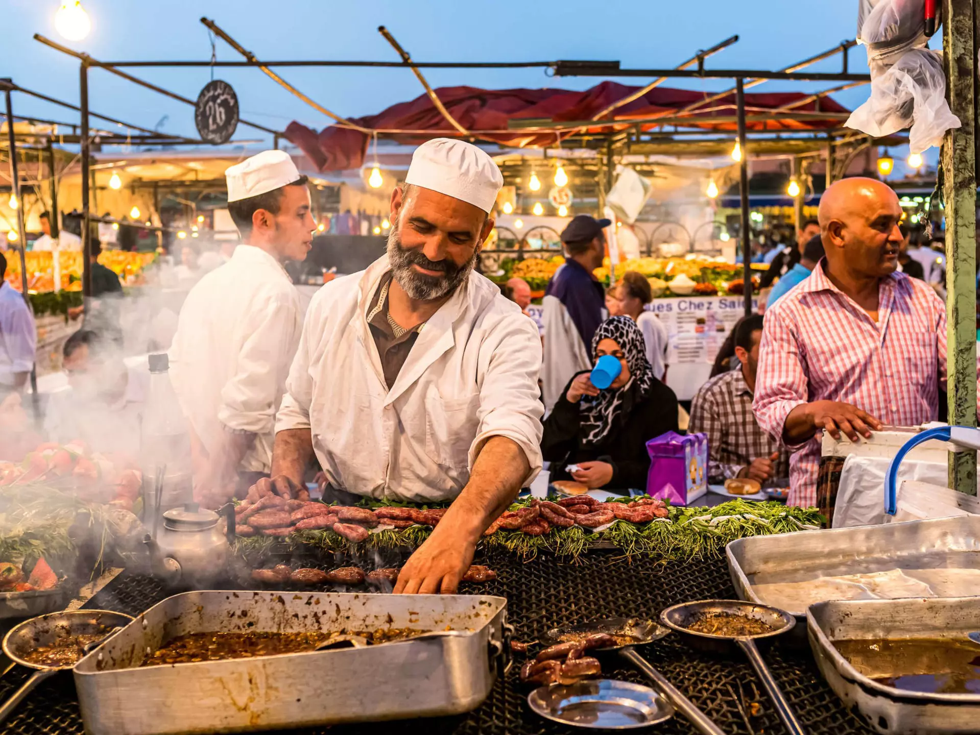 A cook at a food stall in Jemaa el-Fnaa, the main square of Marrakesh, Morocco.