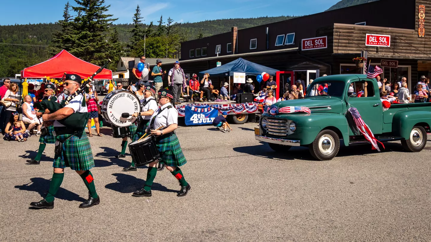 Skagway, Alaska / United States - July 4 2018: Fourth of July Parade with antique truck and bag pipe band passing the reviewing stand, License Type: media, Download Time: 2025-12-03T20:07:02.000Z, User: mvm_lonelyplanet, Editorial: true, purchase_order: 56530 - Guidebooks, job: Alaska 15, client: Global Publishing-WIP, other: Virginia Moreno