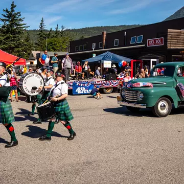 Skagway, Alaska / United States - July 4 2018: Fourth of July Parade with antique truck and bag pipe band passing the reviewing stand, License Type: media, Download Time: 2025-12-03T20:07:02.000Z, User: mvm_lonelyplanet, Editorial: true, purchase_order: 56530 - Guidebooks, job: Alaska 15, client: Global Publishing-WIP, other: Virginia Moreno