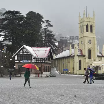 SHIMLA, INDIA - MARCH 2: People walking early morning after fresh spell of snowfall at Ridge on March 2, 2015 in Shimla, India. The picturesque tourist resorts of Shimla and Manali received more snow on Monday as the temperatures remained below the freezi
SHIMLA, INDIA - MARCH 2: People walking early morning after fresh spell of snowfall at Ridge on March 2, 2015 in Shimla, India. The picturesque tourist resorts of Shimla and Manali received more snow on Monday as the temperatures remained below the freezing point at most places in Himachal Pradesh. (Photo by Santosh Rawat/Hindustan Times via Getty Images)