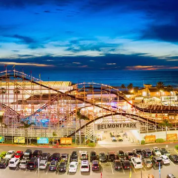 Editorial March 28, 2019 - Belmont Park roller coaster in Pacific Beach, San Diego California. Aerial drone photo taken late evening.; Shutterstock ID 1401262877; your: Bridget Brown; gl: 65050; netsuite: Online Editorial; full: POI Image Update