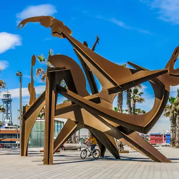 Sculpture Homenaje a la Natacio by Alfredo Lenz on Placa del Mar, Barceloneta in Barcelona, Spain.
