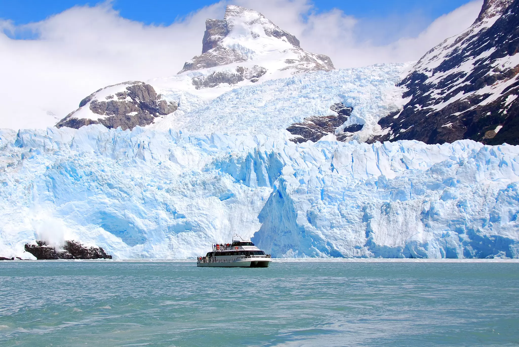 View of tourist boats in front the Perito Moreno glacier in Argentina.