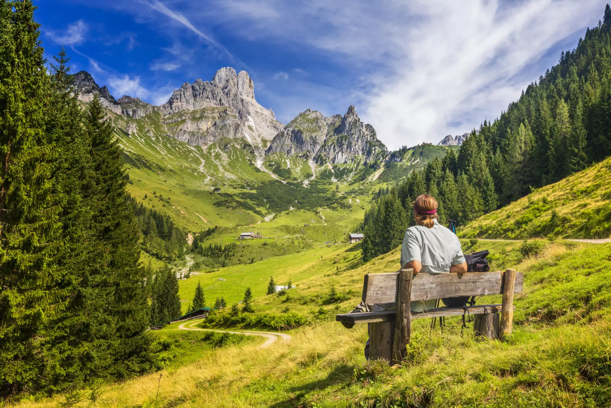 A man admiring the Alpine landscapes in the Dachstein Massif