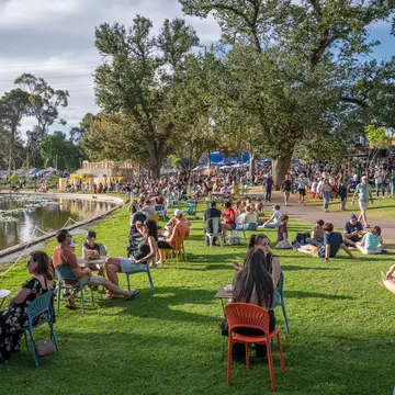 Adelaide, South Australia, Australia - March 23 2025; Fringe Festival Crowds in the evening sun in Rymill Park in  East Park Lands, License Type: media, Download Time: 2025-08-27T16:39:27.000Z, User: clairenaylor, Editorial: true, purchase_order: 65050 - Digital Destinations and Articles, job: Onlined editorial, client: Guide to South Australia , other: Claire Naylor