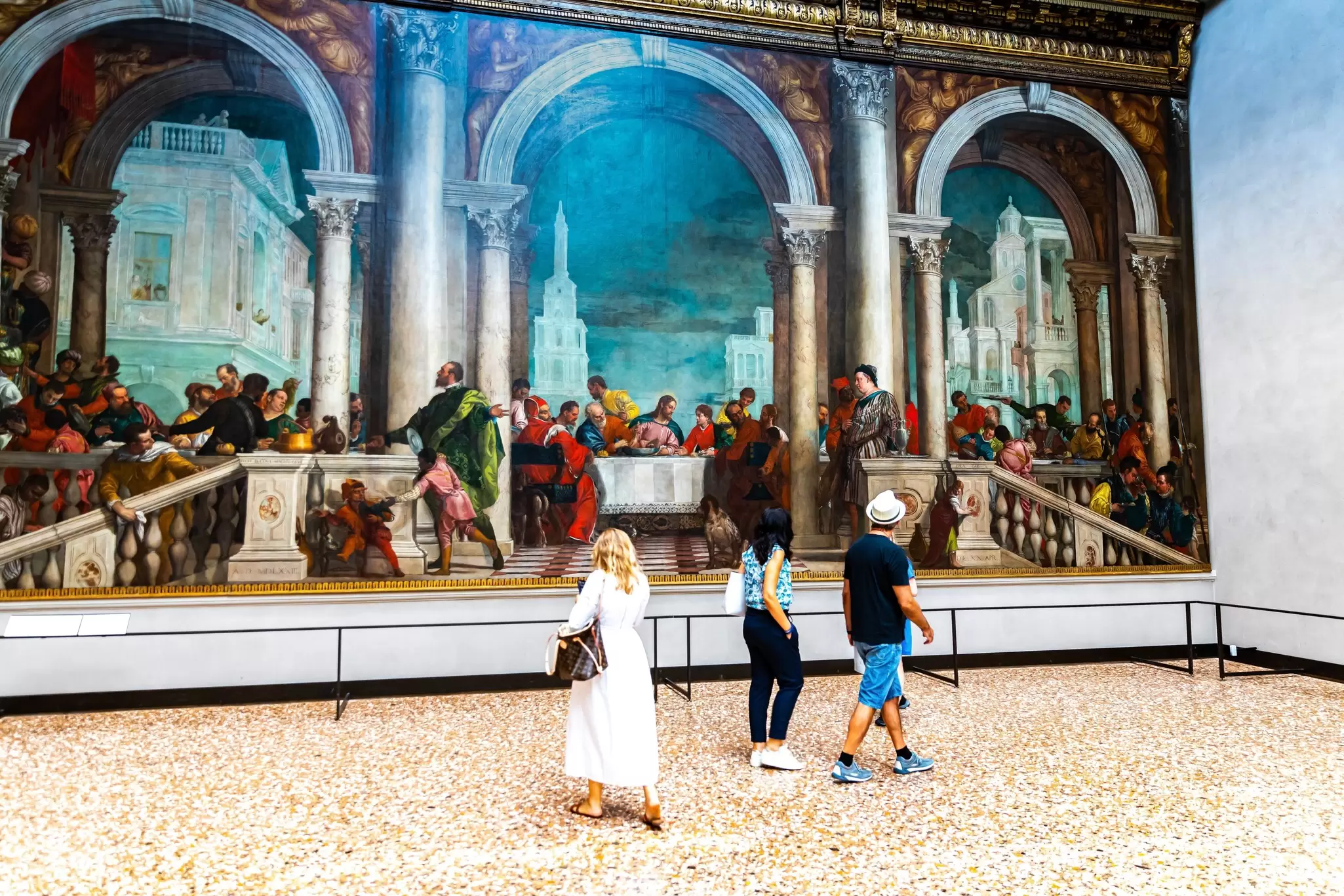 Visitors passing by Paolo Veronese's 'Feast in the House of Levi' at the Gallerie dell’Accademia in Venice, Italy.