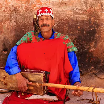 Moroccan street musician on Djemaa el Fna square. Bartosz Hadyniak/Getty Images
