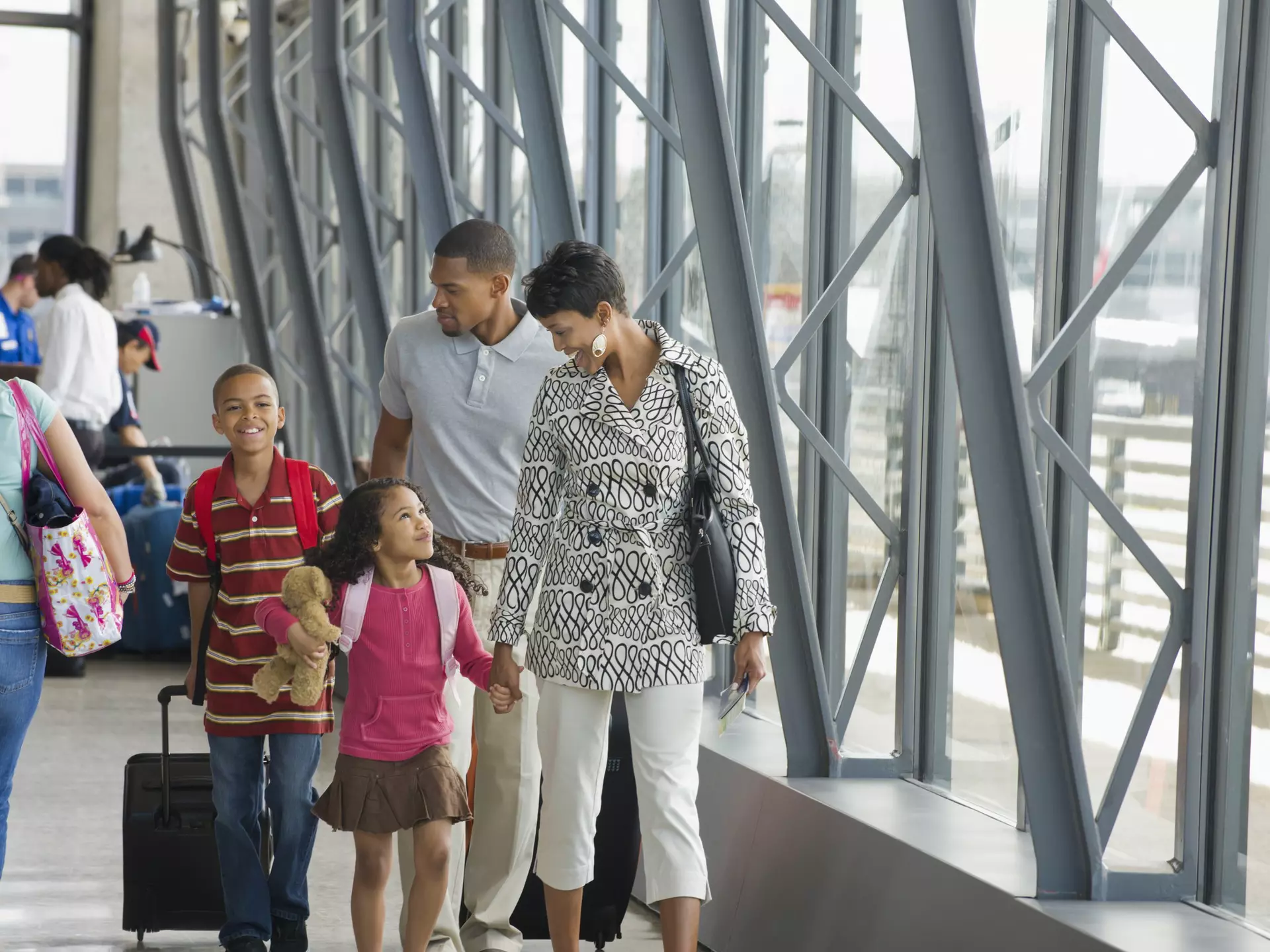 Family walking together in airport