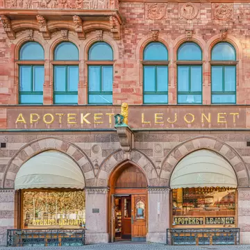 Malmo, Sweden - April 11, 2020  Historical Apoteket Lejonet (Lejonet Pharmacy) facade with the Pasaje Lejonet or passage El Leon, in front of the Stortorget square. Old facade with apothecary entrance  License Type: media  Download Time: 2023-06-25T09:06:09.000Z  User: hannahblackie10  Is Editorial: Yes  purchase_order: 56530/Global Publishing WIP  